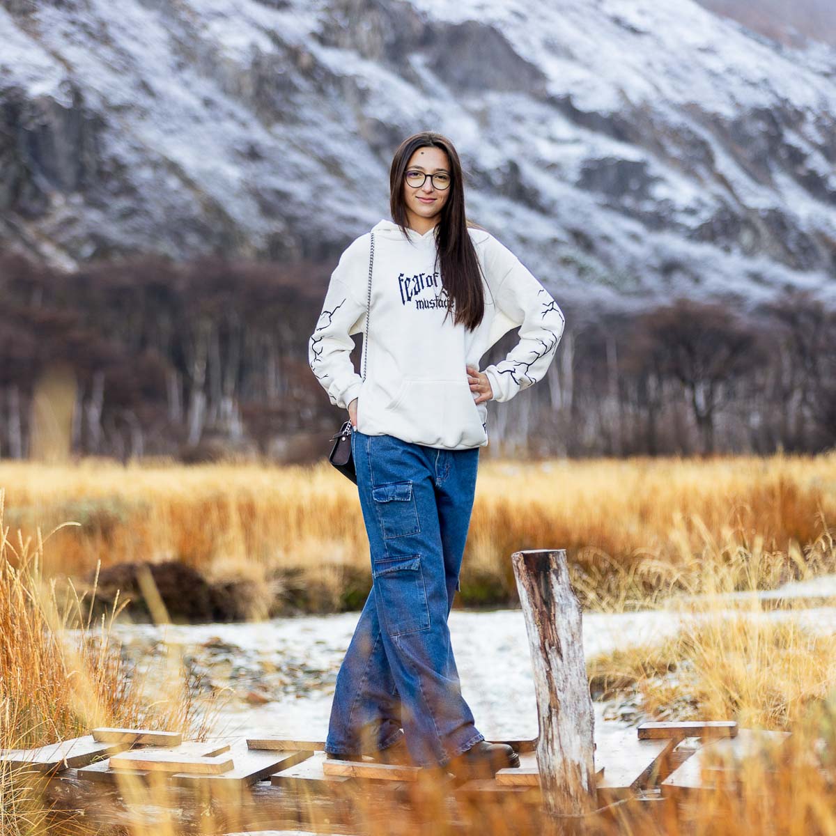 Senior portrait photography in St. Joseph, graduate smiling with cap and gown